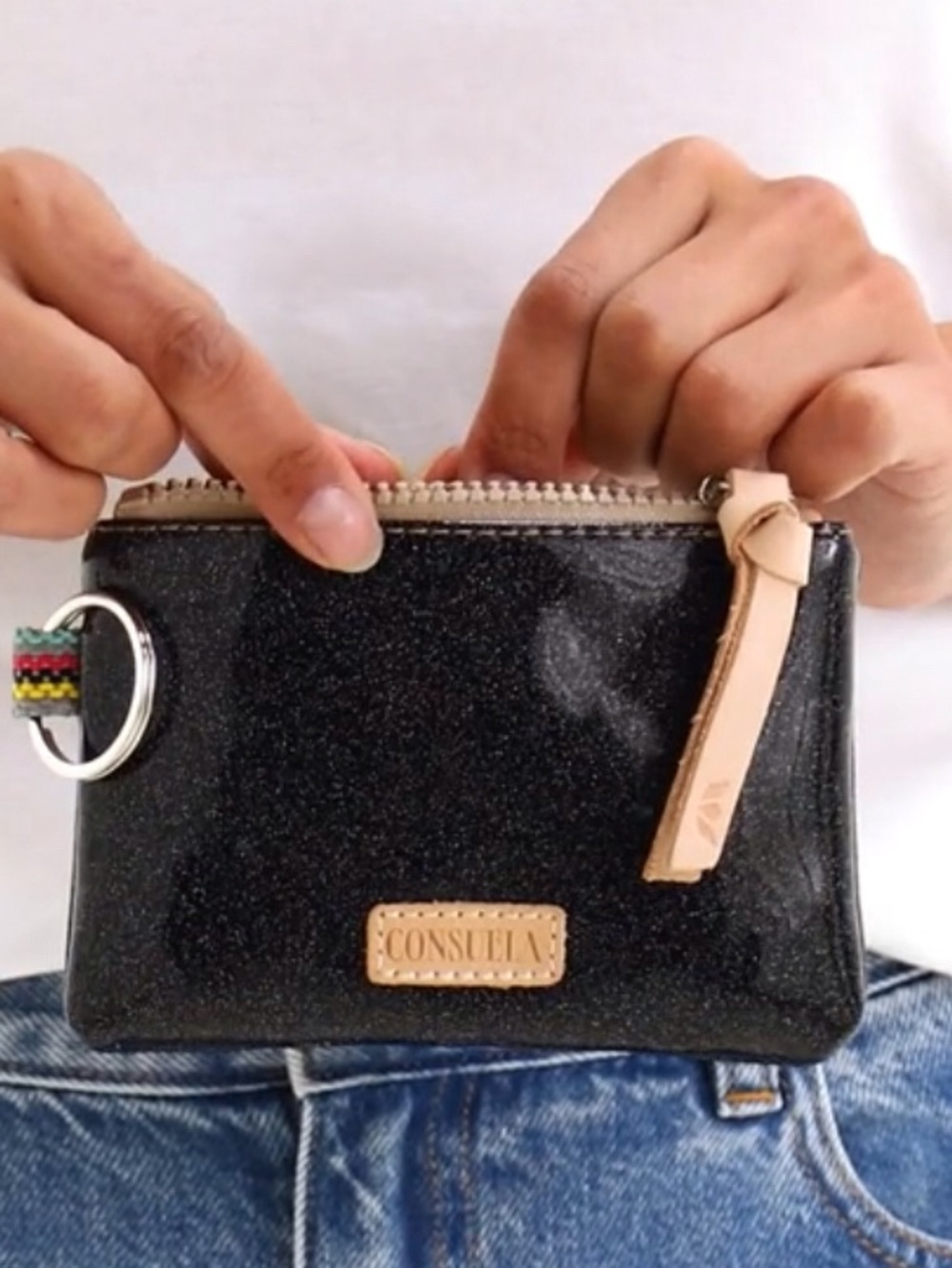 Consuela Mariana Zip Pouch. Black sparkle vinyl with zip and leather trim.